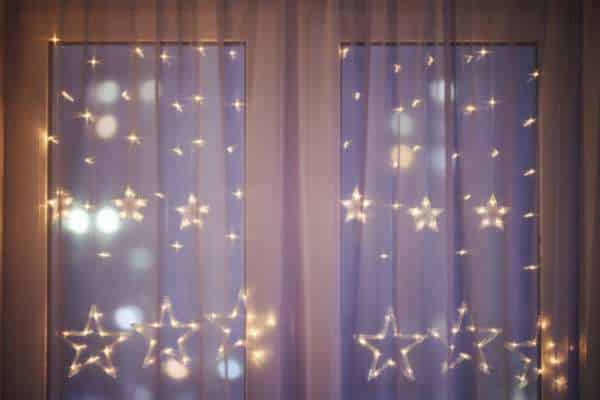 Twinkling Behind Curtains for fairy lights in the bedroom